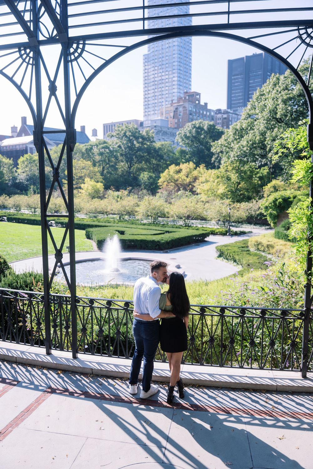 A scenic overlook of Central Park with the NYC skyline visible in the background.