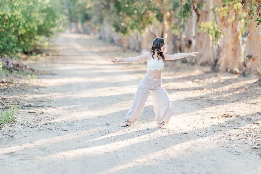 Simi Valley senior at Corriganville Park captured at sunset with yoga poses for unique, personalized senior photos.