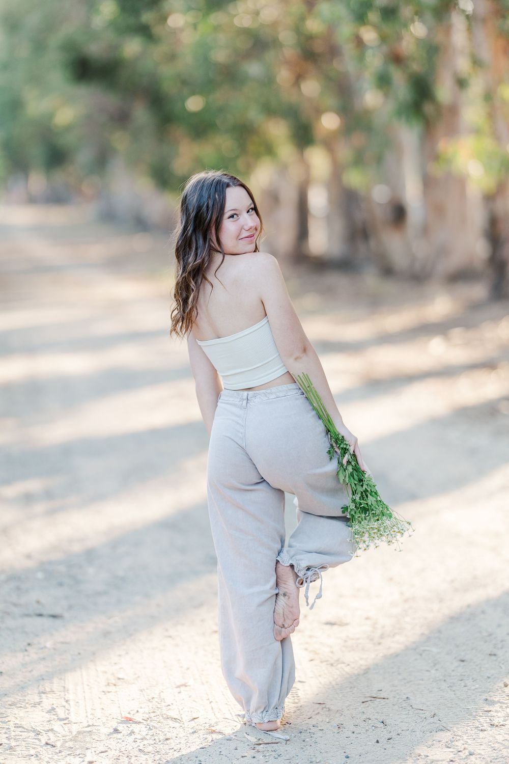 Simi Valley senior at Corriganville Park captured at sunset with yoga poses for unique, personalized senior photos.
