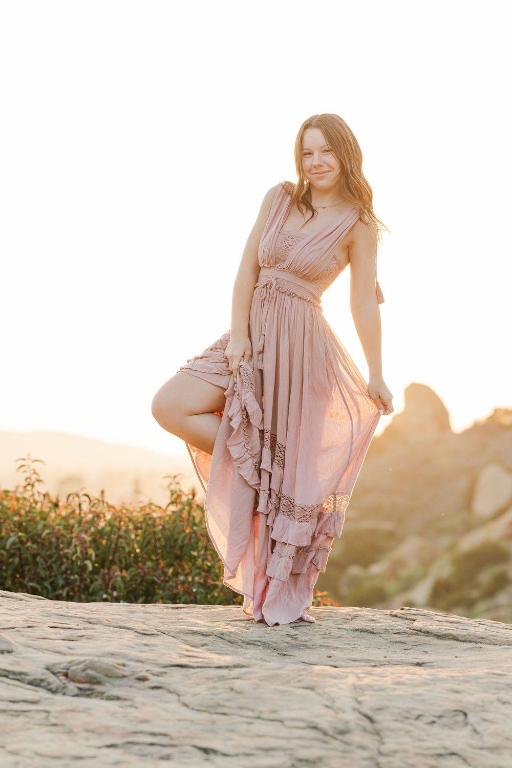 Simi Valley senior at Corriganville Park captured at sunset with yoga poses for unique, personalized senior photos.