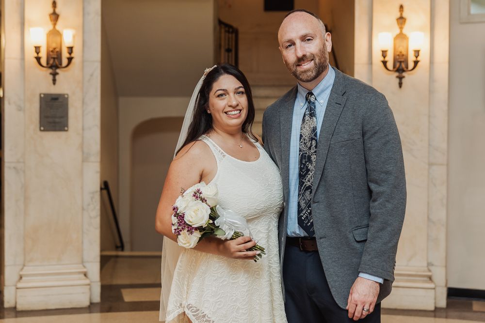 Wedding portraits captured in an elegant indoor venue with warm lighting and classic decor.