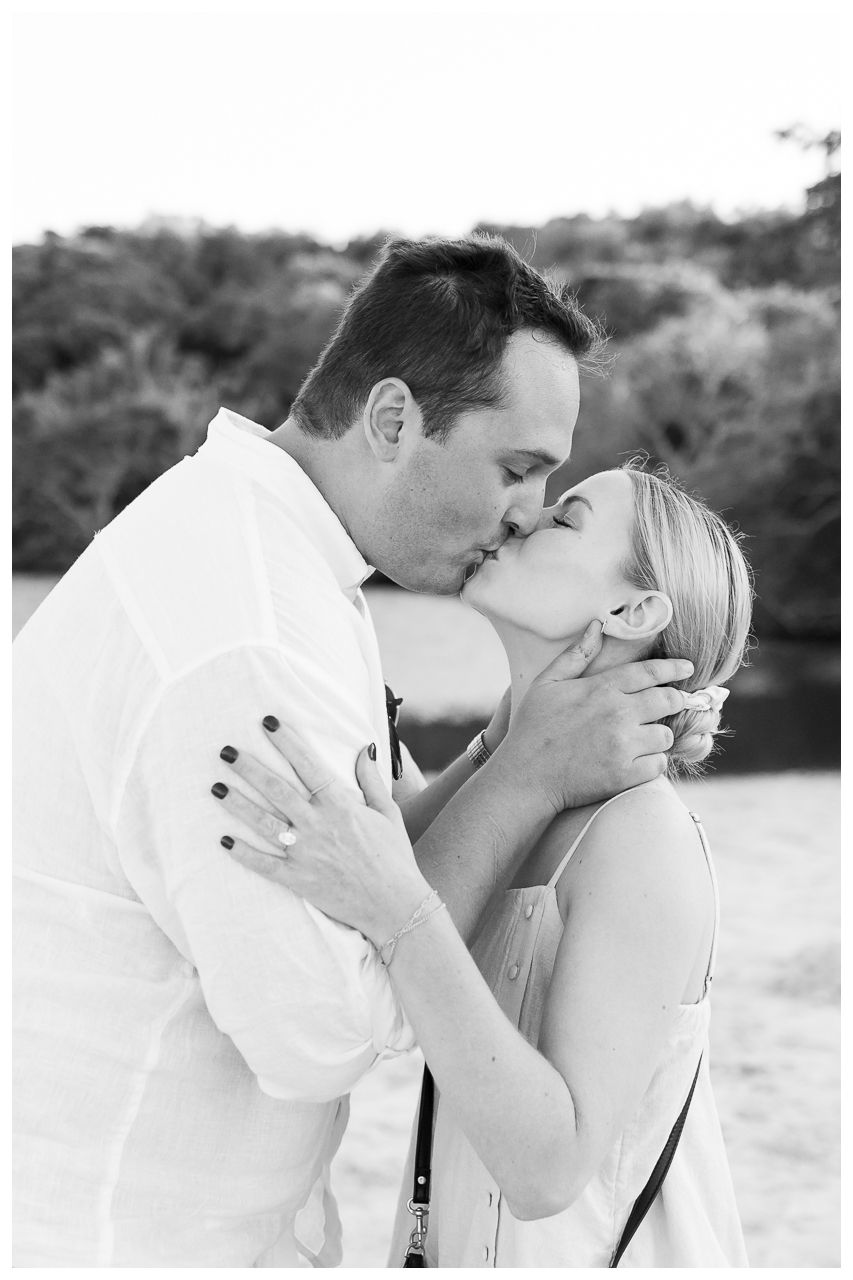 A romantic black and white photo sequence showing a couple sharing tender kisses outdoors.
