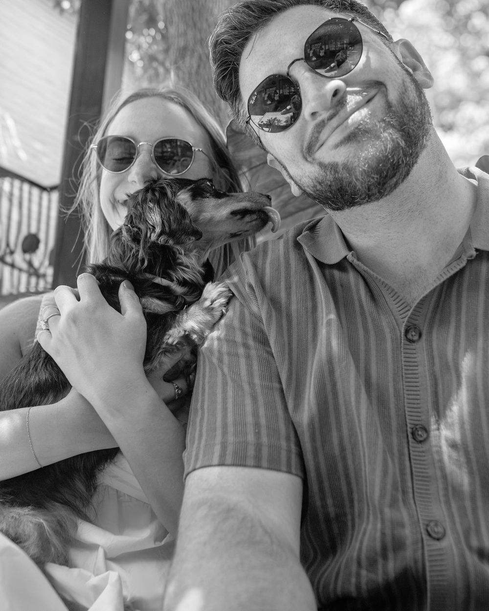 A black and white photo sequence showing people in sunglasses making silly faces and expressions together outdoors.