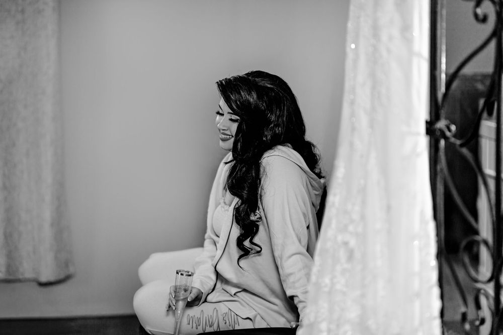 A black and white photo collage shows a bride getting ready on her wedding day in an elegant room.