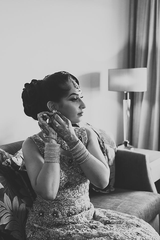 A series of black and white photos showing a person in an ornate dress posing elegantly on a couch.