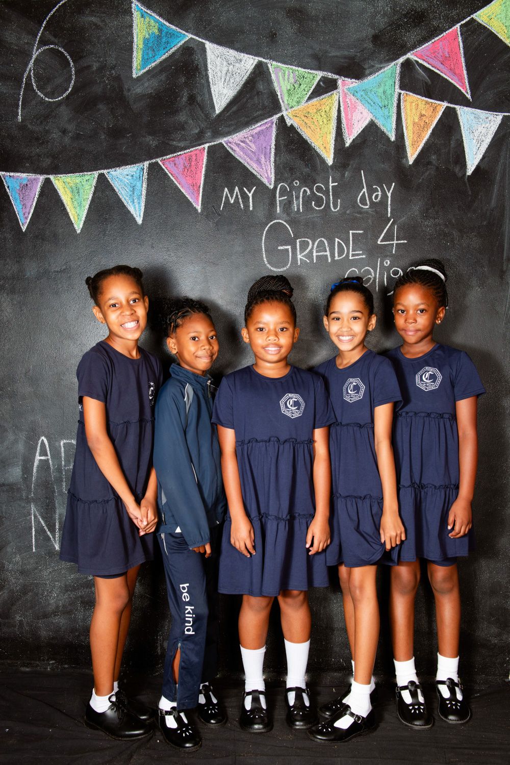 A portrait of school children taken by Rynali In Montana. Five beautiful girls, wearing their school uniform. School photographer.