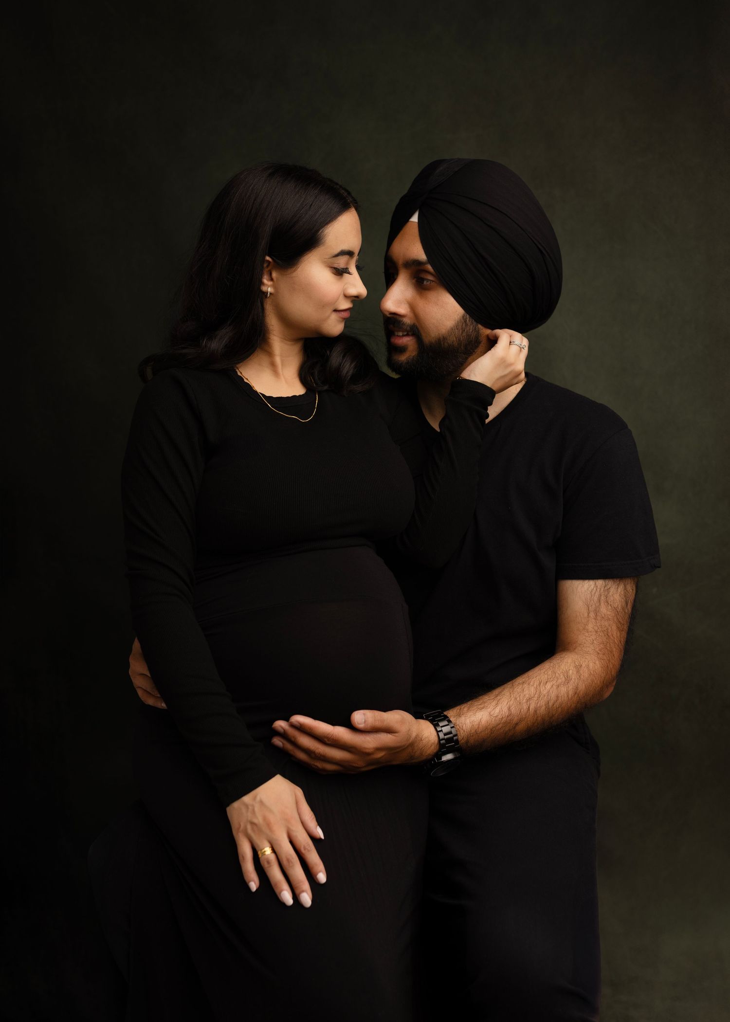 Gurraj and her husband embrace and wait for her first baby Elizabeth Lang Photography Surrey Cloverdale.