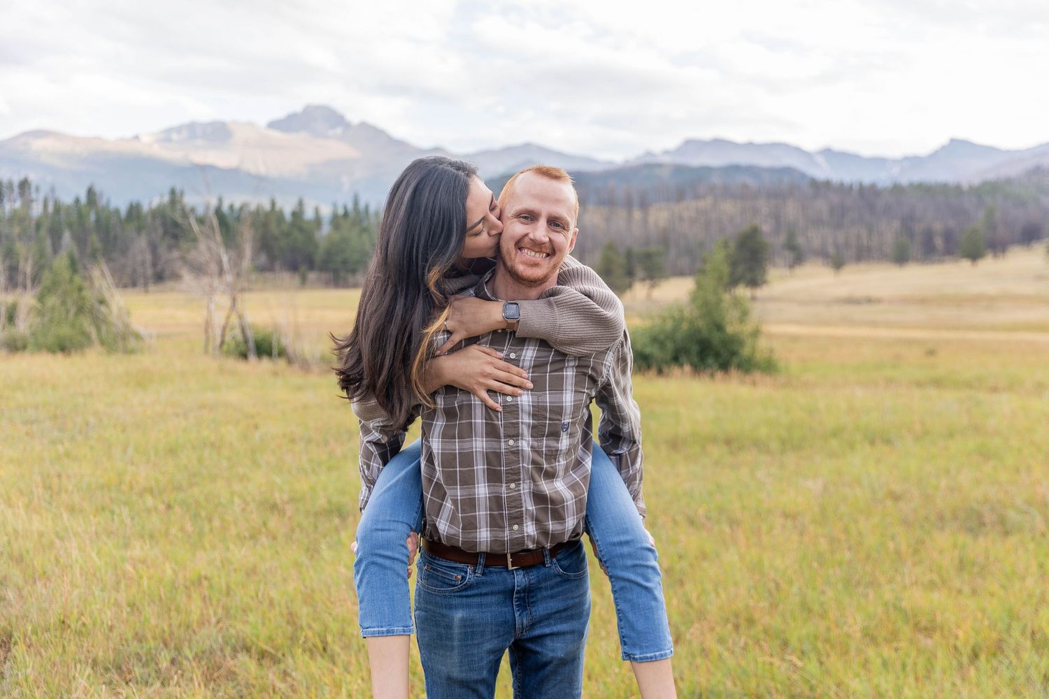 couple dancing at sunset in Upper Beaver Meadows, wildflower field and soft golden light, quiet RMNP elopement