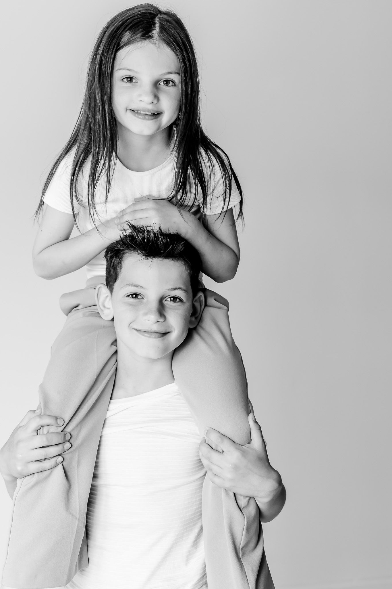 Fun Sibling Photo idea. Brother and Sister posing idea. Studio sibling posing ideas. Lake Forest Kids Photographer.
