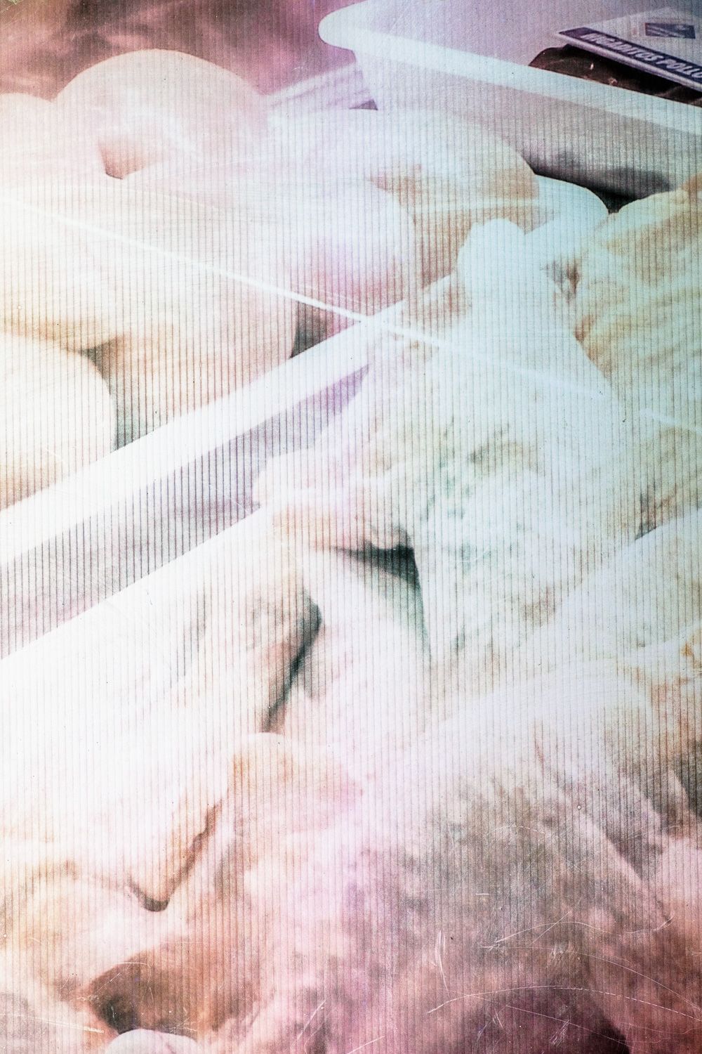 Abstract art with dreamy pastel clouds in soft pink and blue hues creating an ethereal atmosphere.