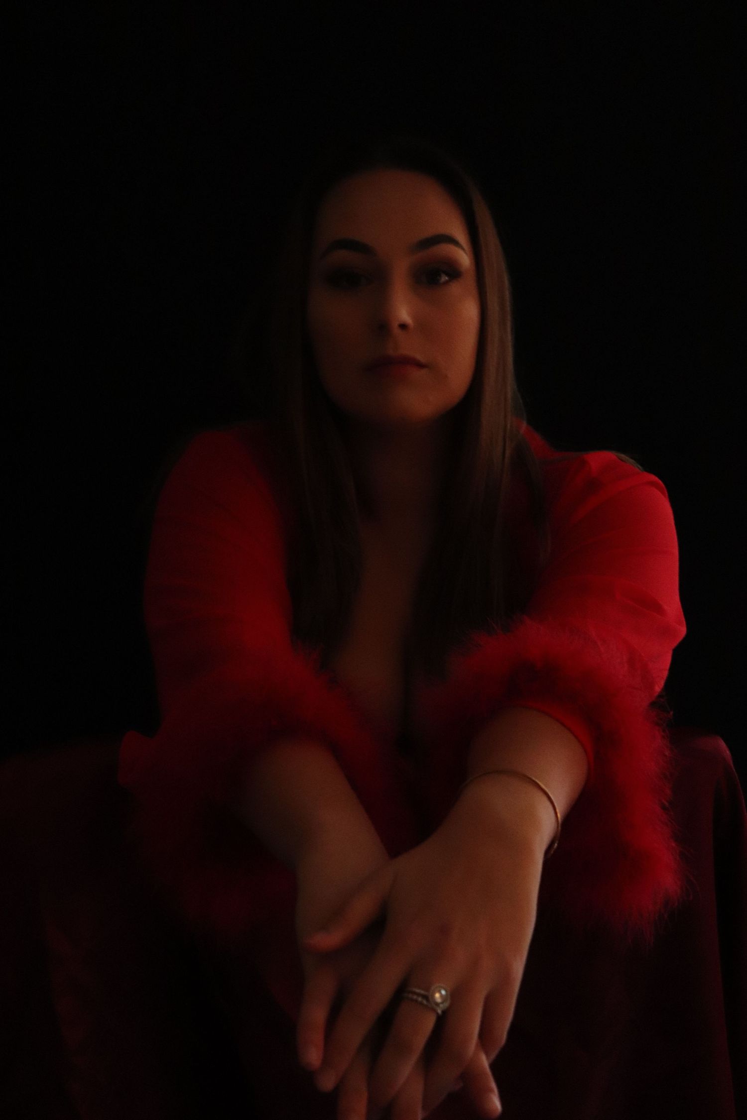 A woman posing for a boudoir photo