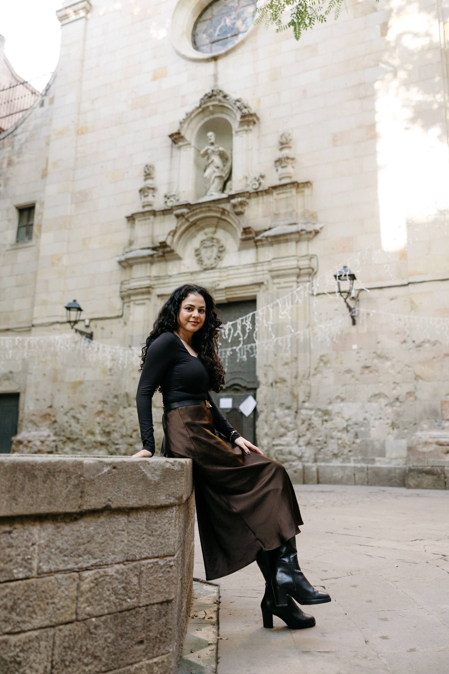 Stone courtyard with ornate architectural details and decorative wall carvings.
