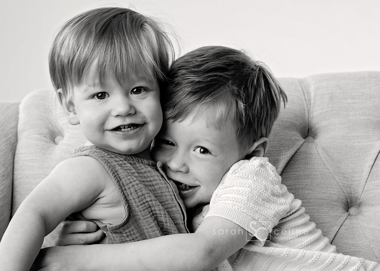 Black and white lifestyle portrait series showing sweet family moments captured during an intimate photo session.