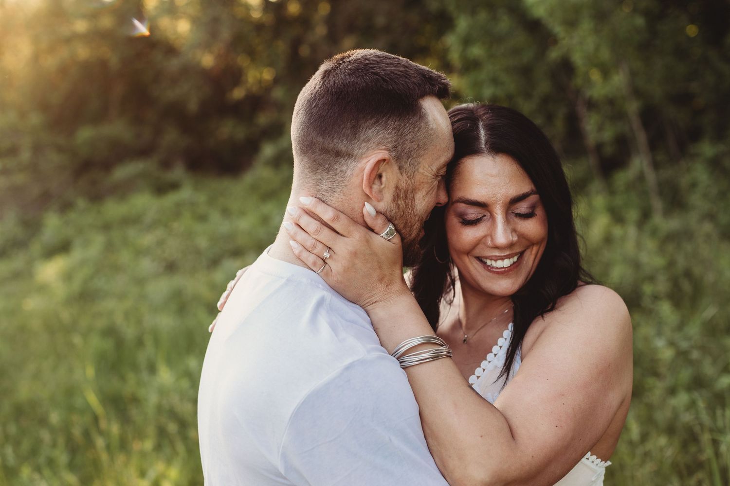 Professional photo of a couple holding each other and smiling