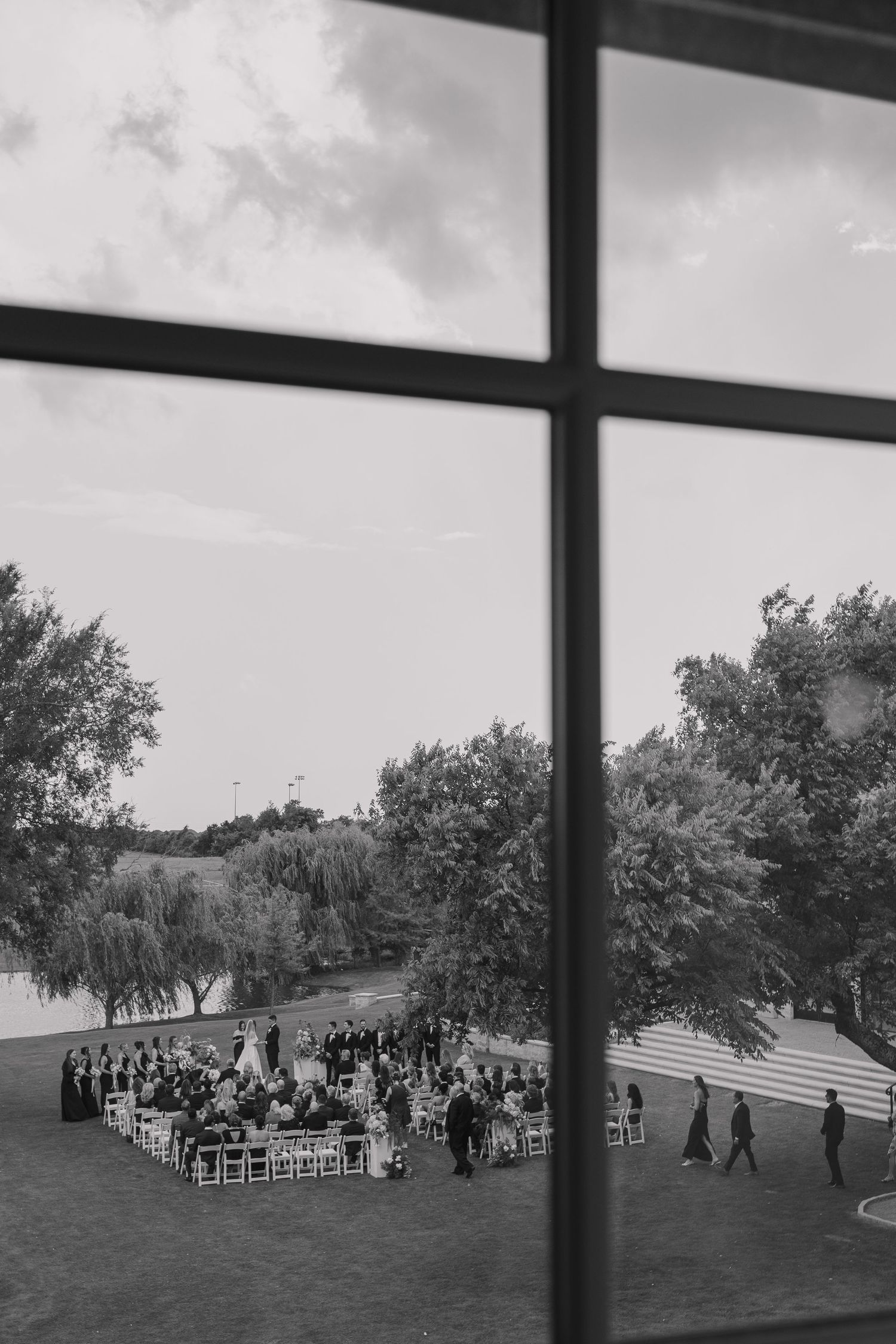Wide shot of outdoor wedding ceremony setup at The Bower estate-style venue in Oklahoma