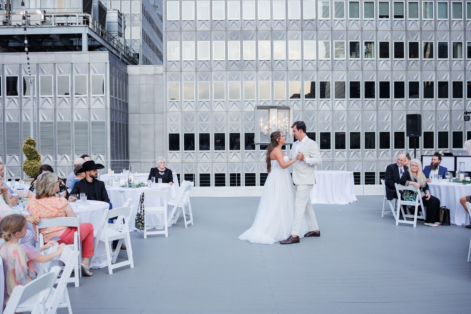 Couple dances during their rooftop wedding at The Venue at 400 North Ervay, a Dallas wedding venue