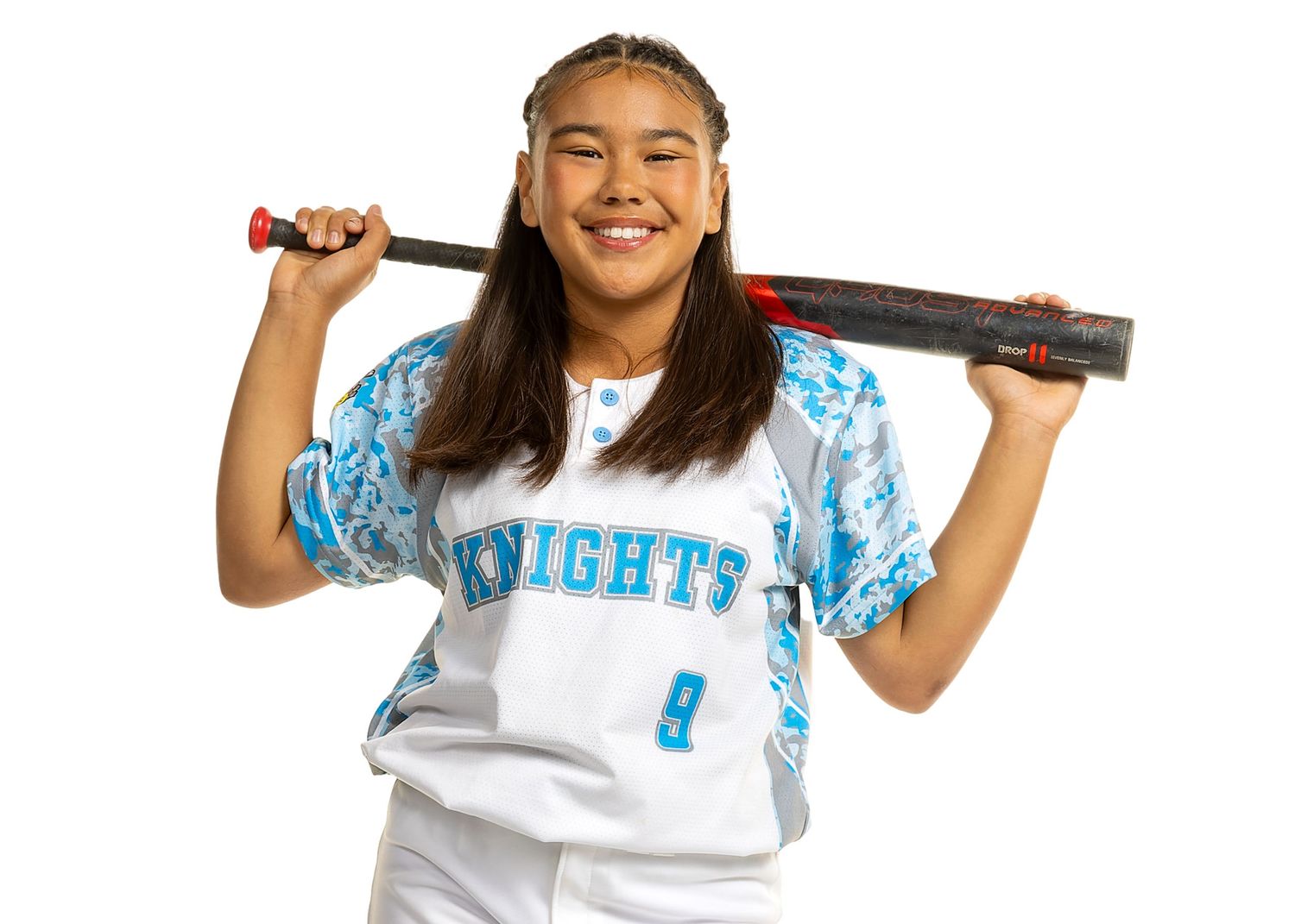 Sports player poses with softball bat in Knights uniform against white background.