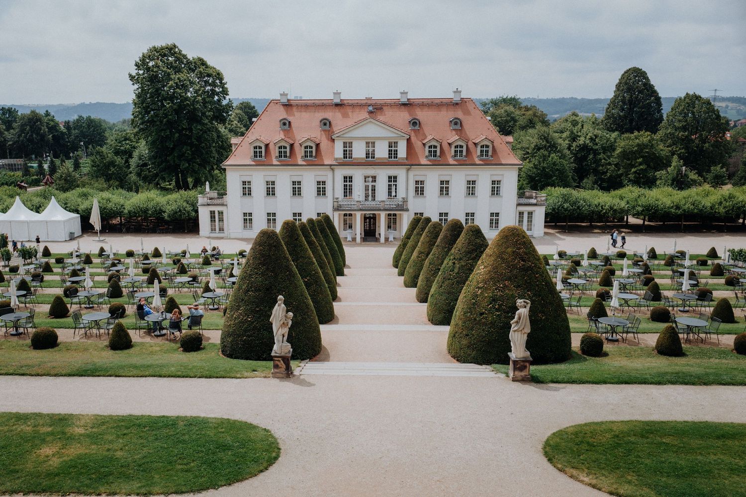Aerial view of a baroque estate with manicured gardens and symmetrical landscaping. Organized wedding by MyCastleWedding | Dresden.