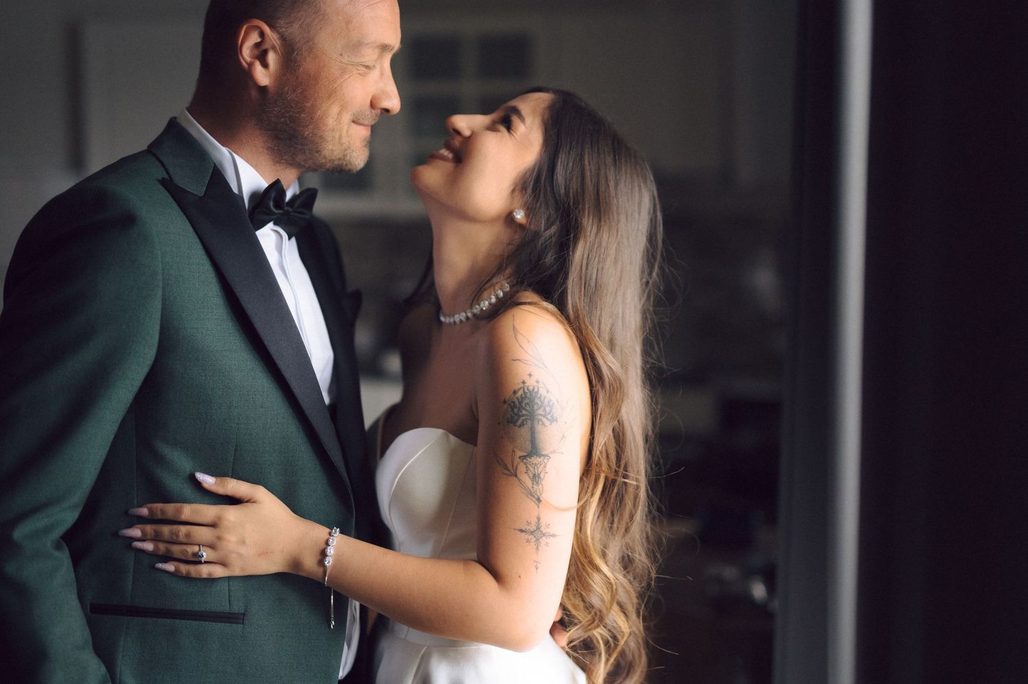 Romantic couple shares intimate moments in formal attire across six wedding day photographs.