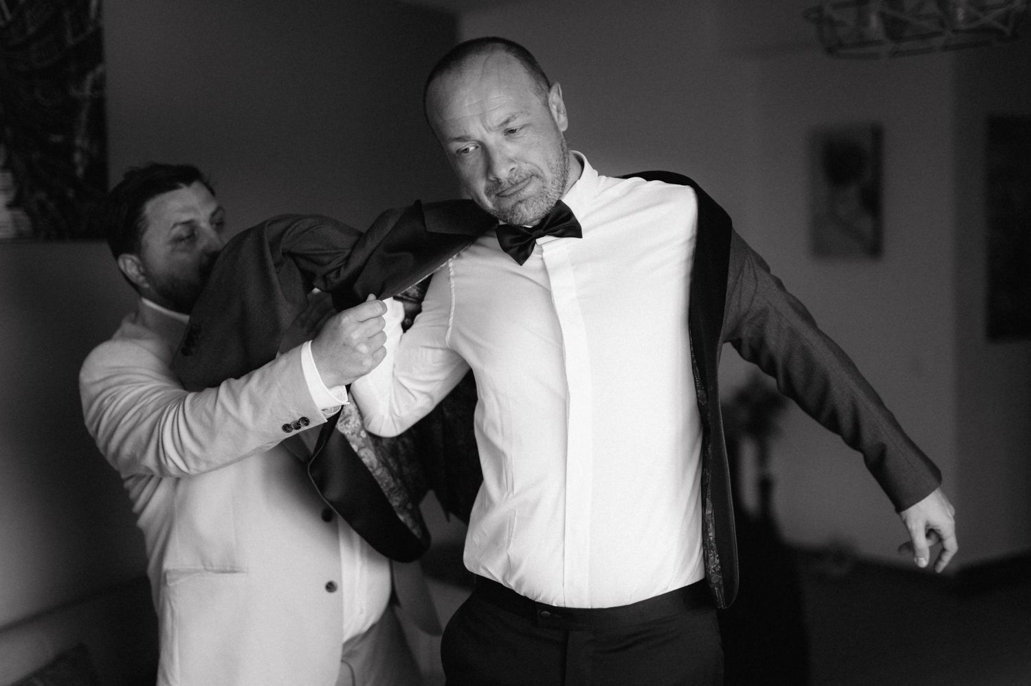 Black and white performance art piece montage showing expressive movements and gestures in formal attire.