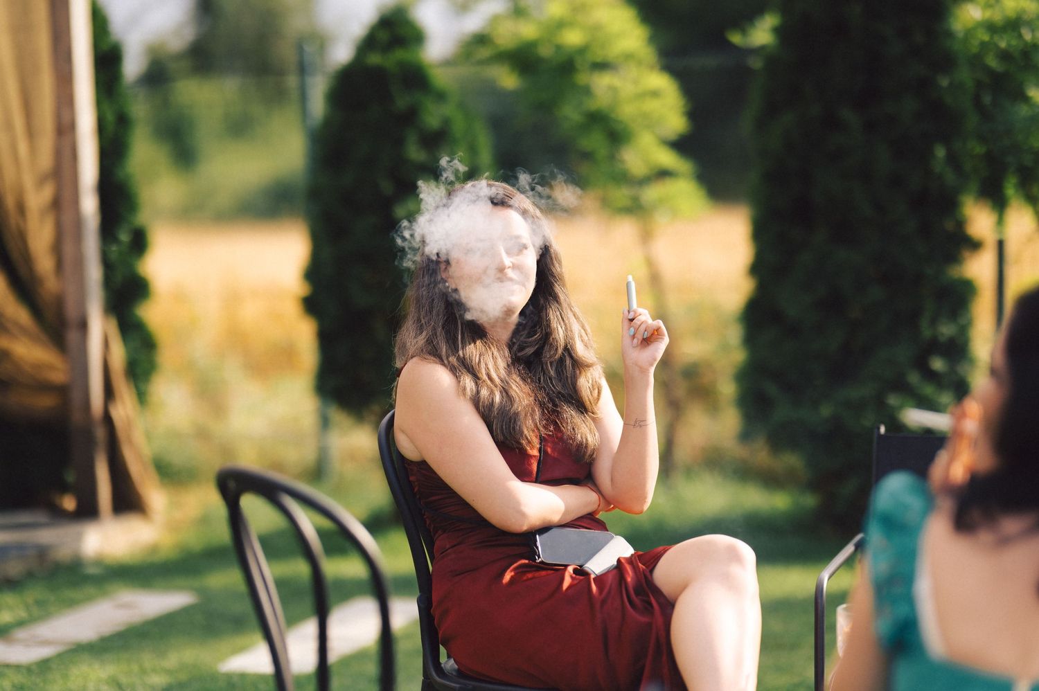 A heartfelt wedding moment captured in a lush garden setting during golden hour sunlight.