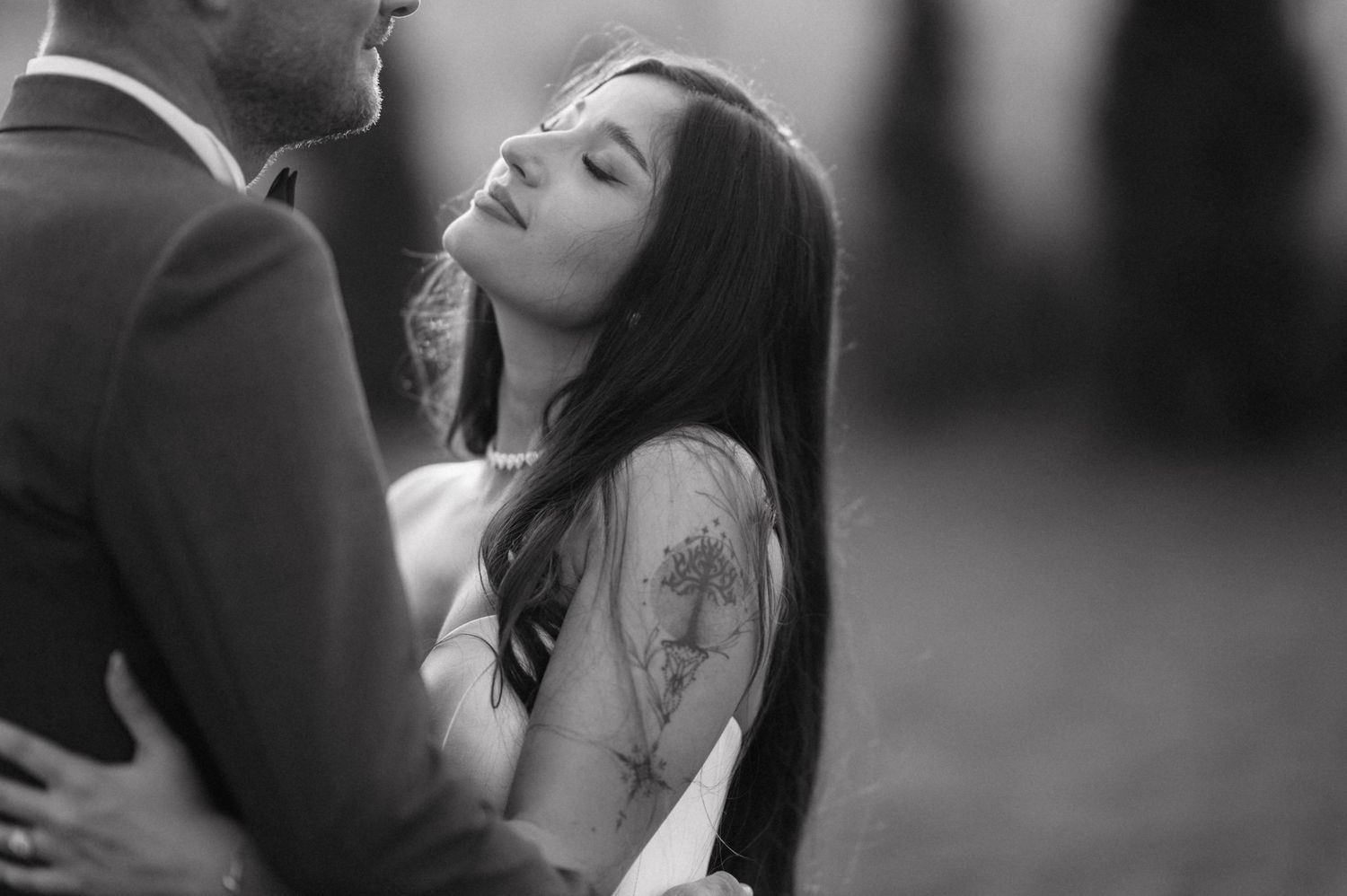 Romantic black and white photo series showing intimate couple embracing in tender candid moments.