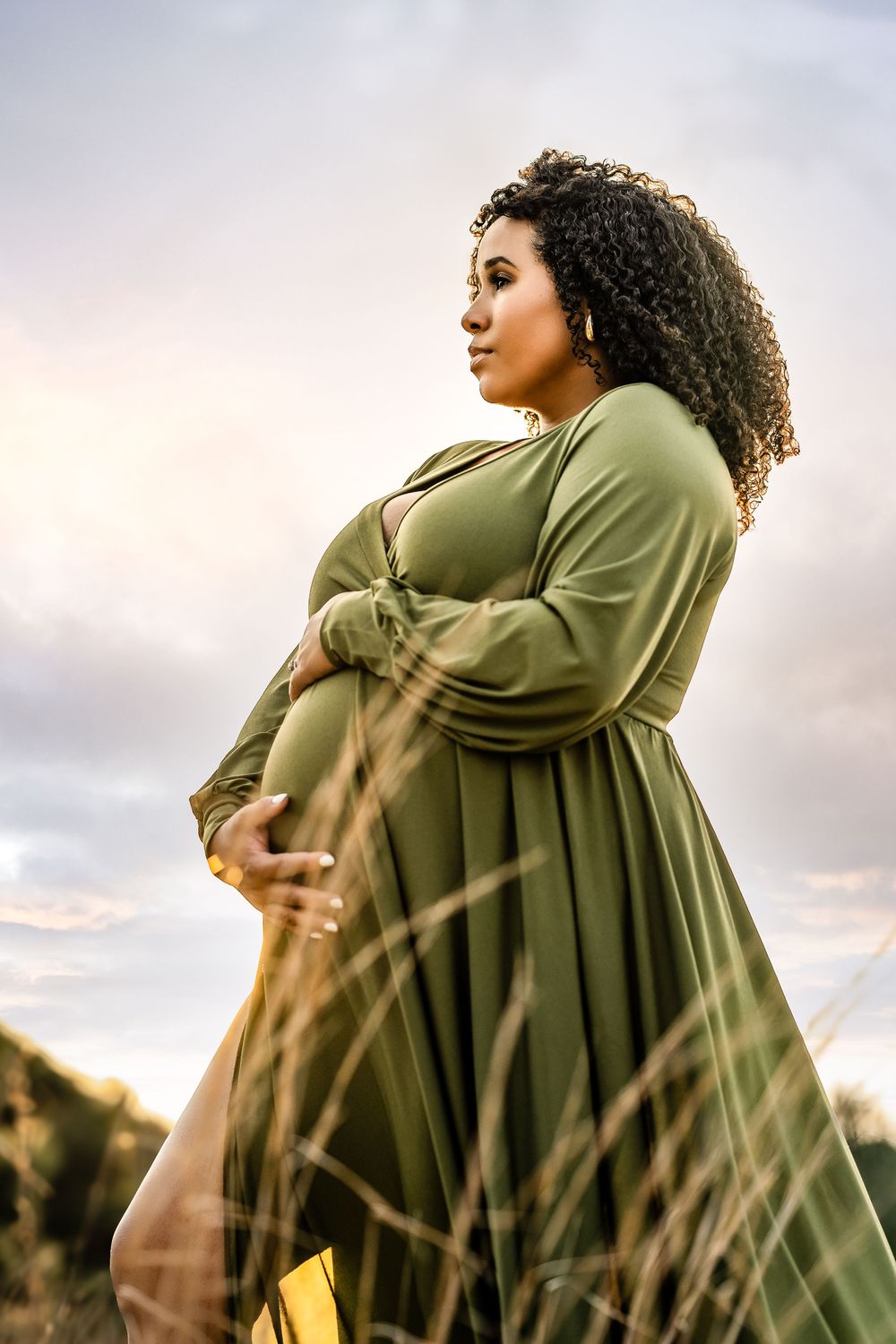 A sequence of photos shows a person in an olive green hoodie spinning joyfully against a sunset sky backdrop.