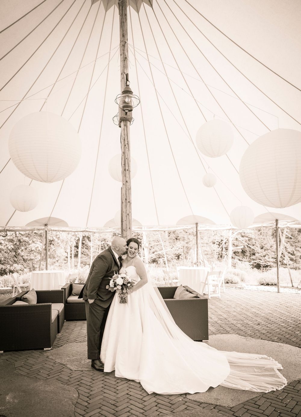 A romantic wedding photoshoot sequence under an elegant white tent with flowing drapery showing a couple in formal attire.