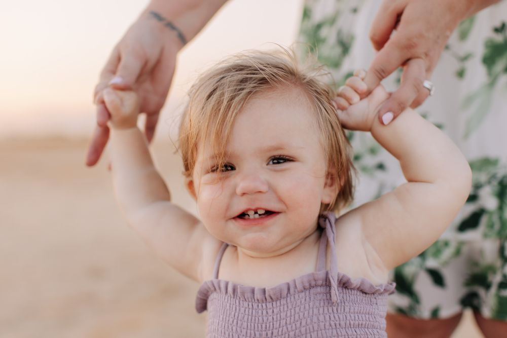 A playful sequence of photos showing a toddler in a purple dress making silly faces and expressions.