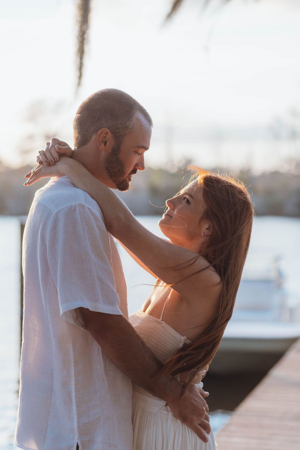 Romantic engagement session of a joyful couple outdoors with natural light in North Carolina.