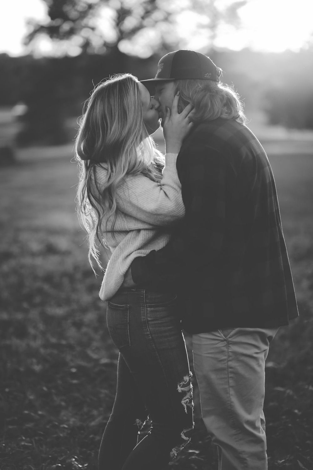 Sweet engagement session of a joyful couple outdoors with natural light in North Carolina.