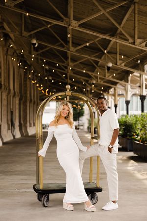 Series of fashion photographs showing a couple in white outfits dancing together under a covered outdoor walkway.