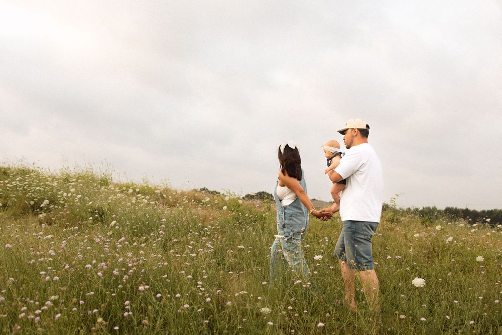Collage of romantic outdoor photo session showing couple embracing in wildflower meadow at sunset.