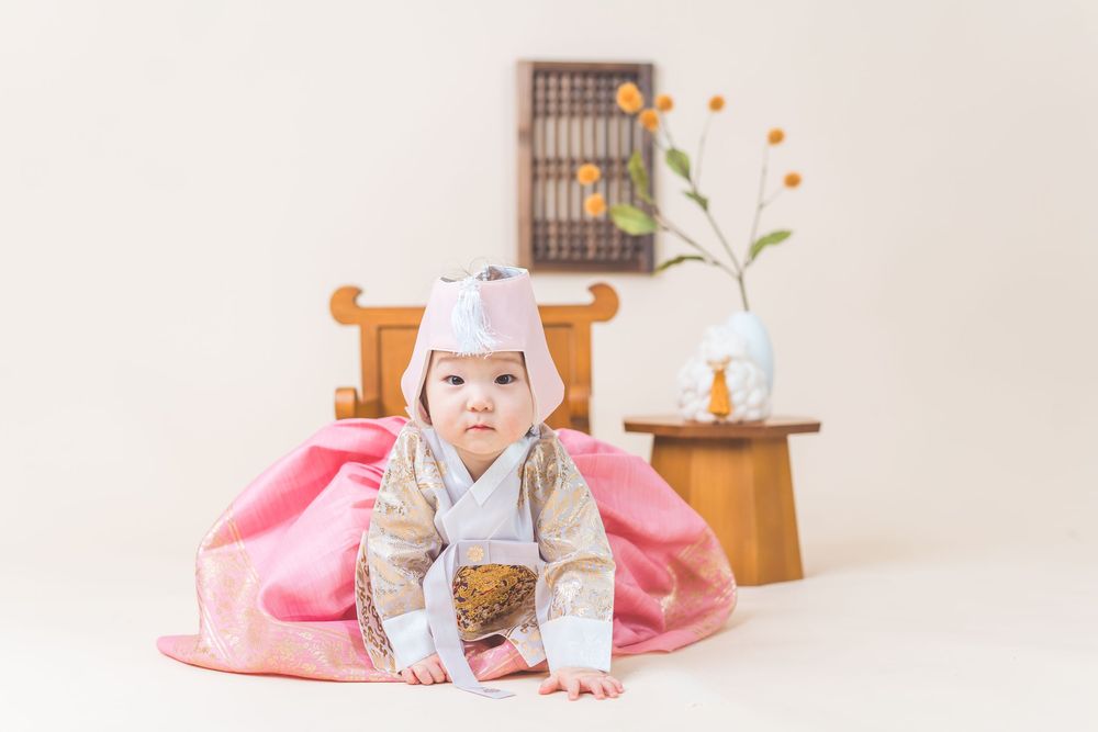 Traditional Korean dress photo with wooden furniture and minimal decor.