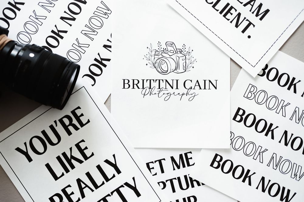 Multiple marketing business cards arranged in a pattern showing text like 'Book Now' in black and white.