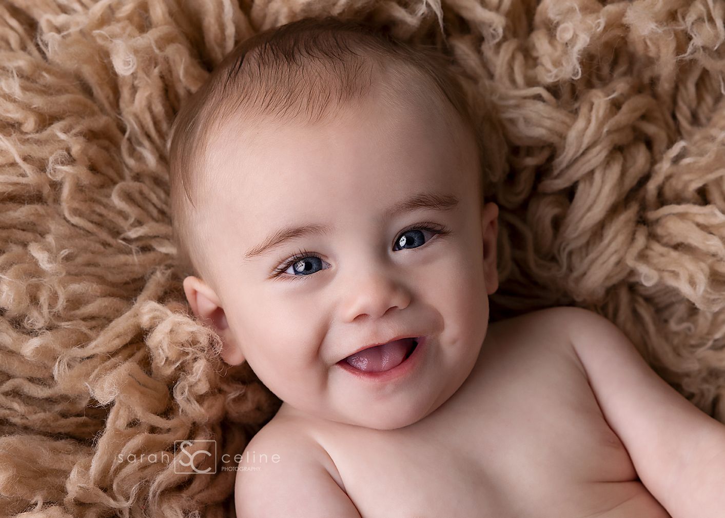 A happy baby lays on soft brown textured fur blanket while expressing different emotions in a photo series.