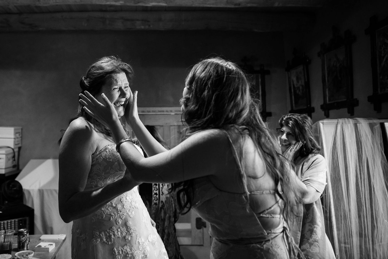 Black and white photo of a bride having a special moment with her daughter in an intimate micro wedding while getting ready in Corrales, NM.