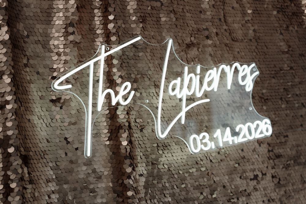 Elegant wedding welcome sign with the couple’s last name as part of the reception decor at a Riviera Maya wedding.