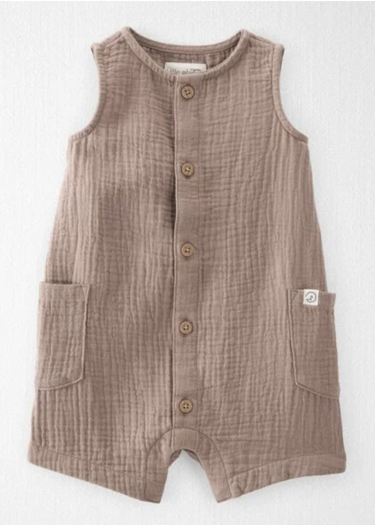 Taupe muslin baby romper with button front, sleeveless design, and patch pockets.