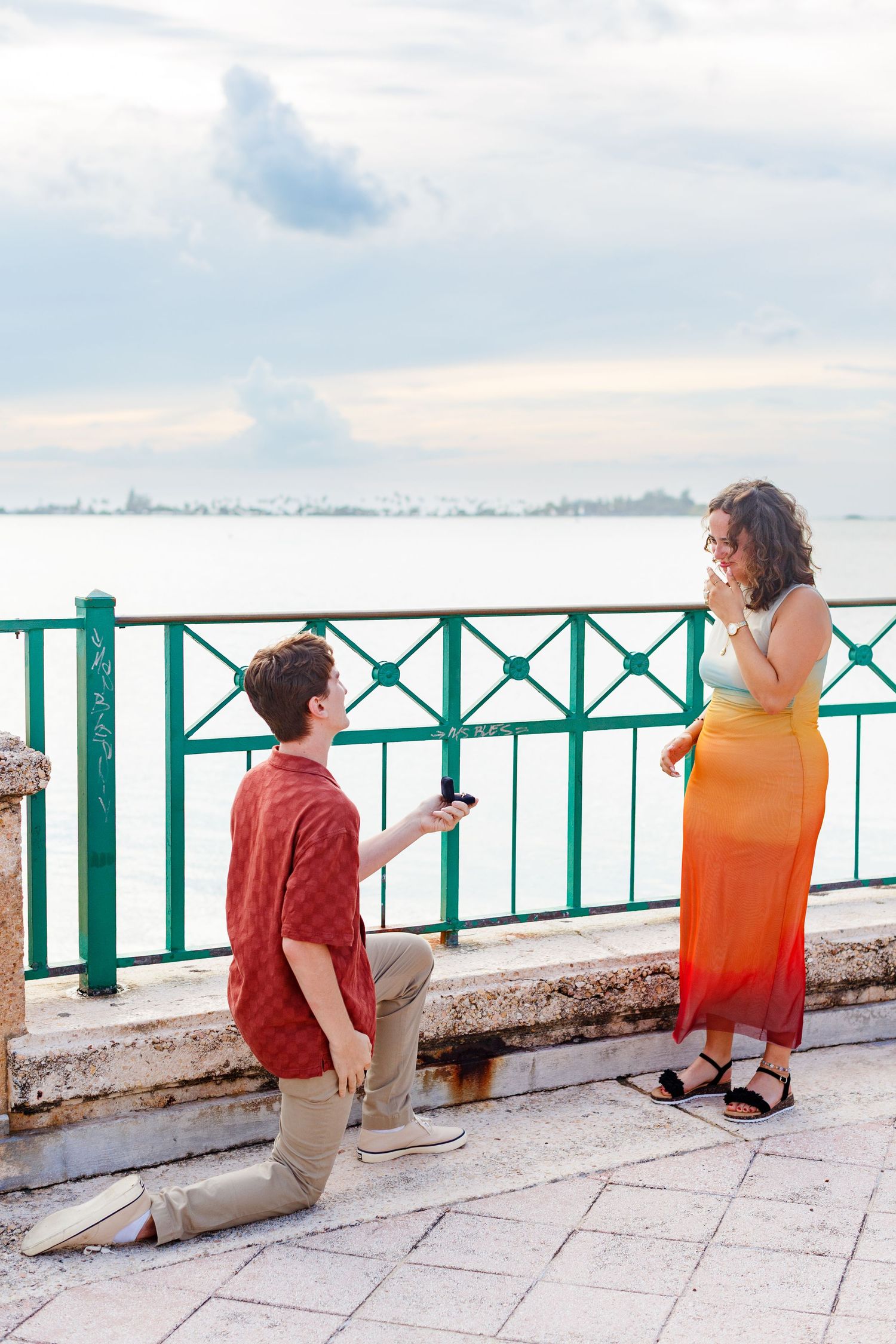 Surprise marriage proposal in Old San Juan, Puerto Rico. Paseo de la Princesa. Man and woman.