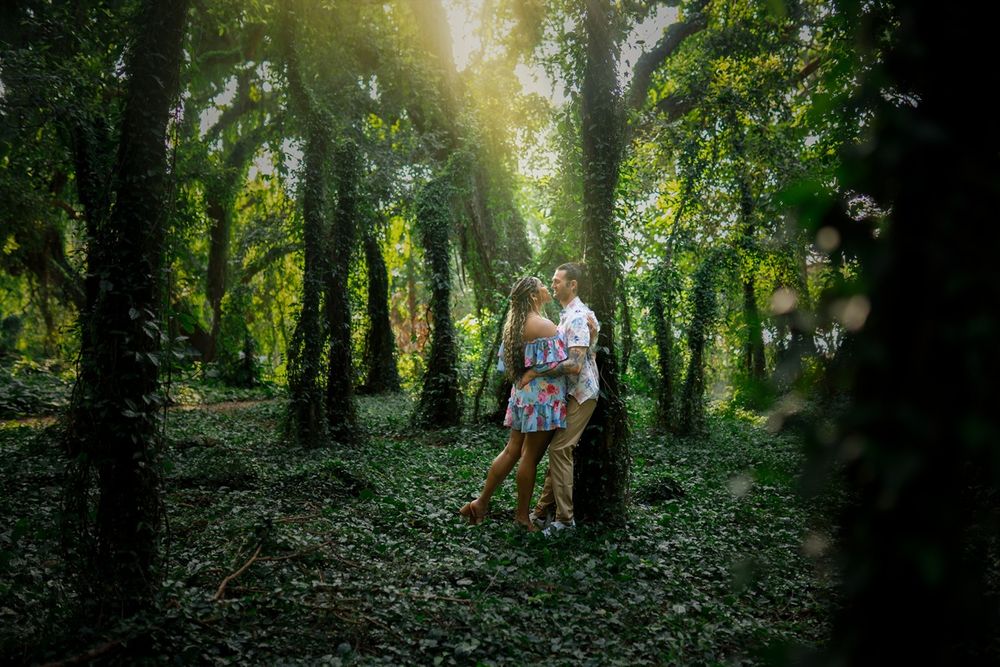 Maui couple engagement photographer photo against beautiful Maui green lush forest by ohwowfotos.