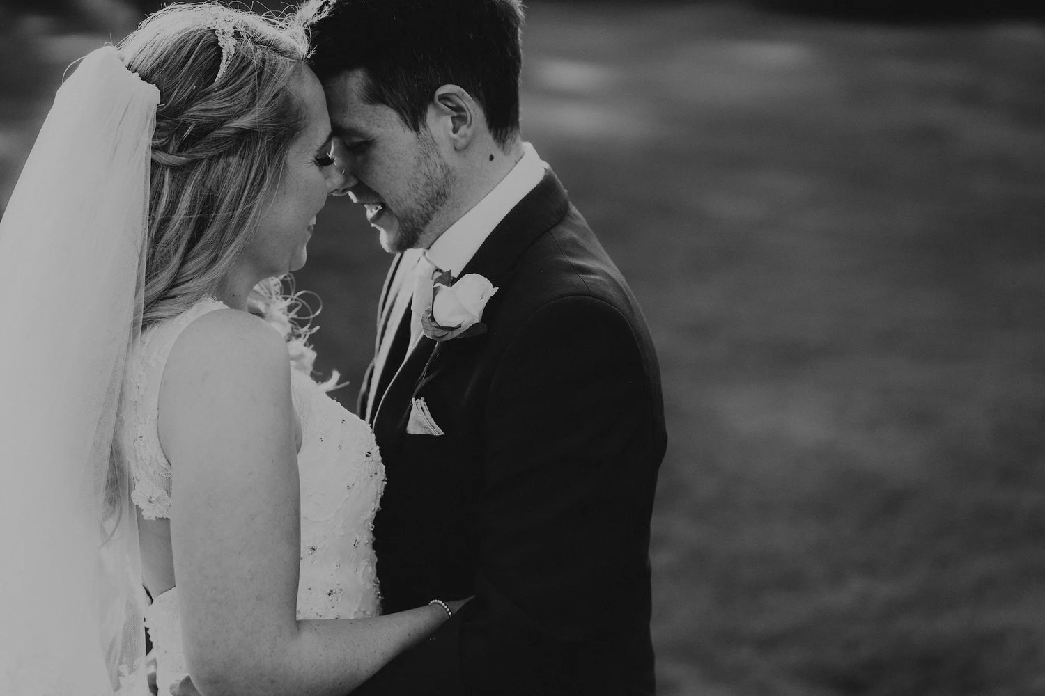 Intimate black and white wedding portraits showing romantic moments.