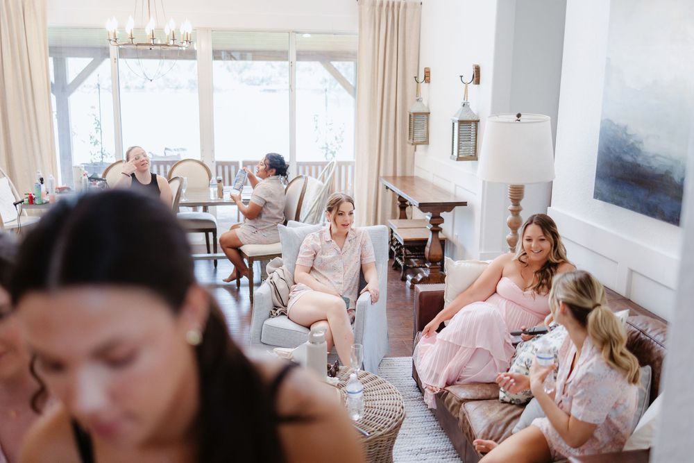 Group in a bright living room enjoying a relaxed gathering with natural light streaming through windows.