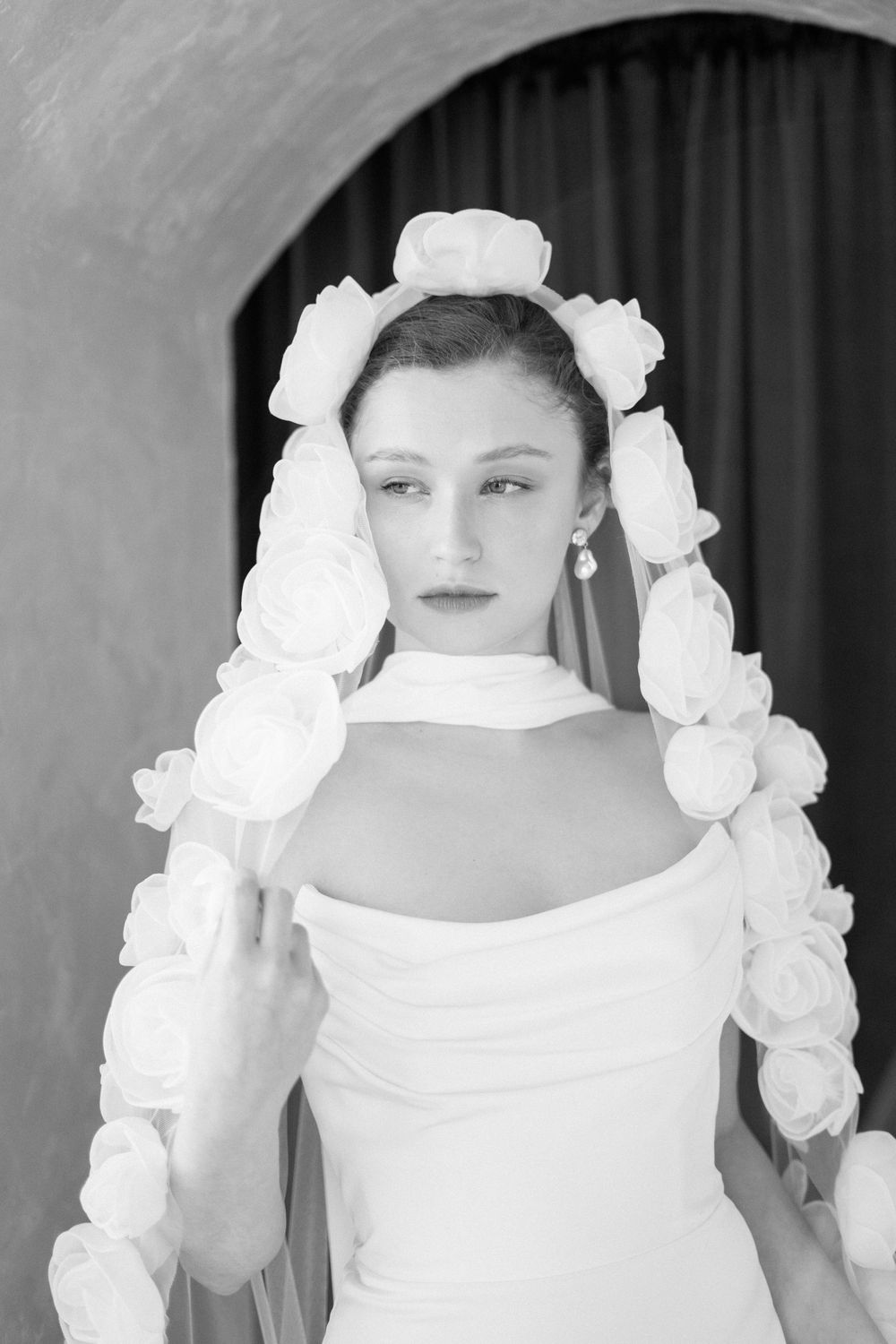 A sequence of portrait photos decorated with white roses showing different angles and closeup views.