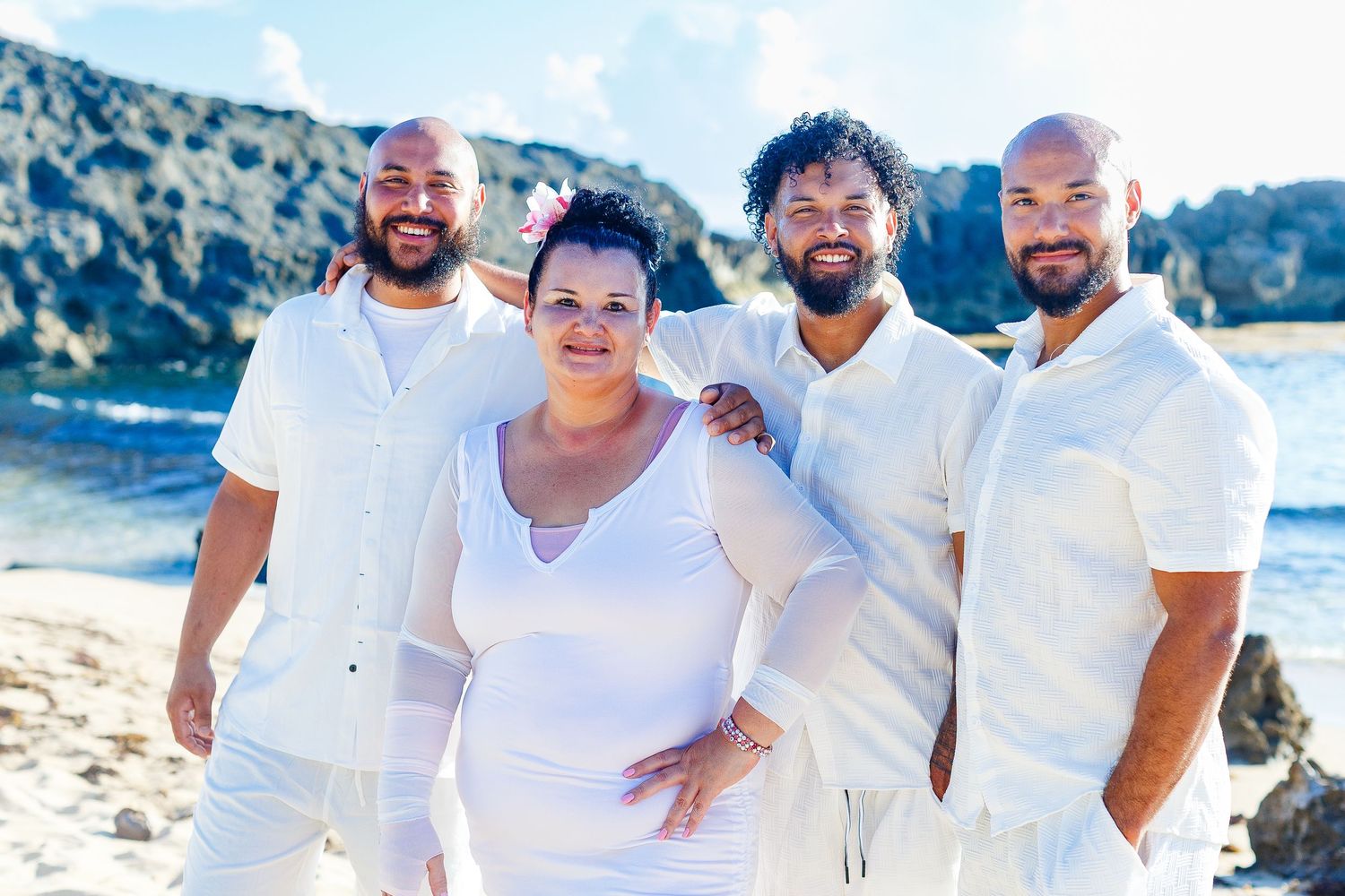 Family portrait on the beach. Mother and three sons. Playa Mar Chiquita, Puerto Rico.