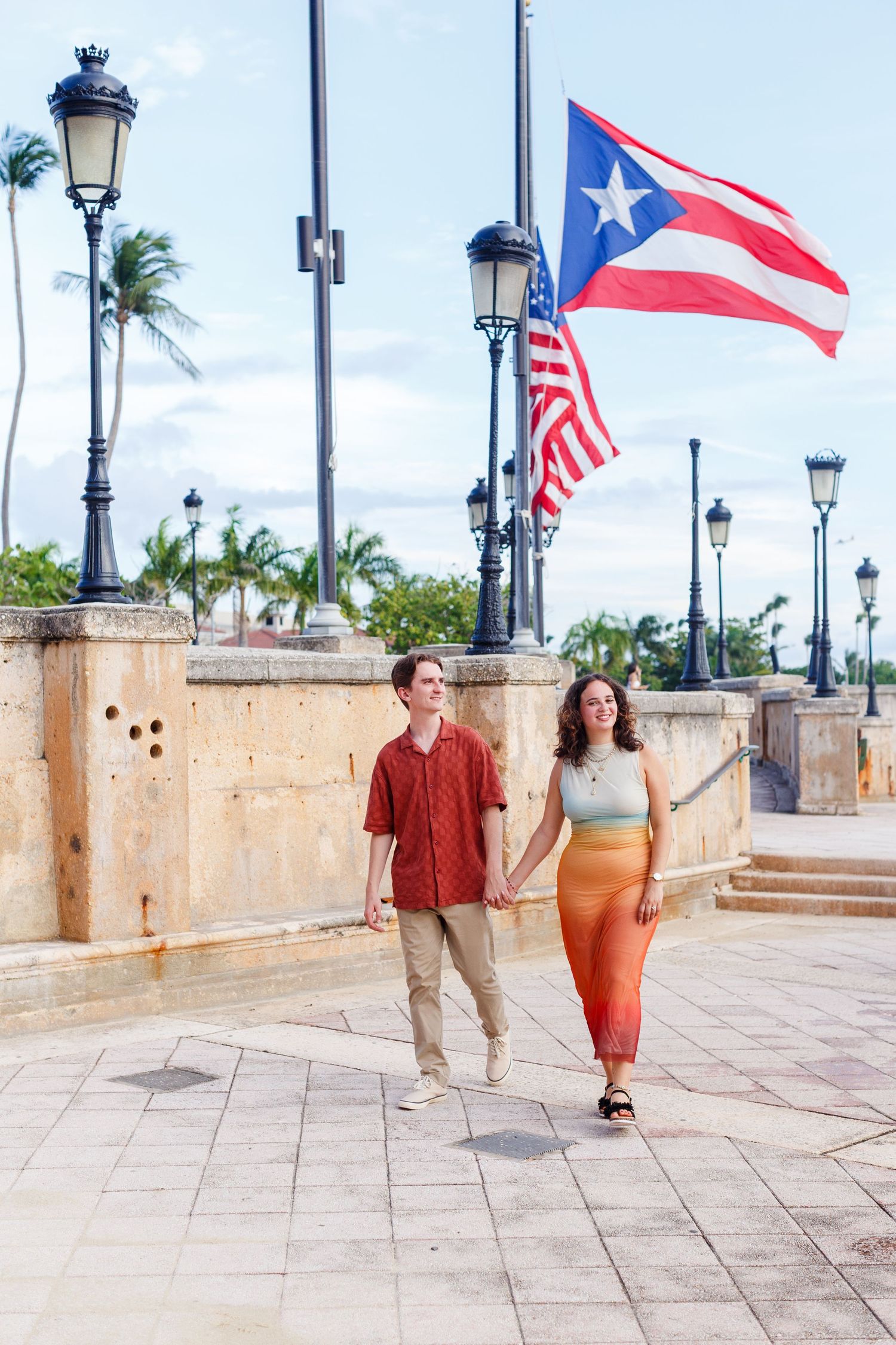 Surprise marriage proposal in Old San Juan, Puerto Rico. Paseo de la Princesa. Man and woman.