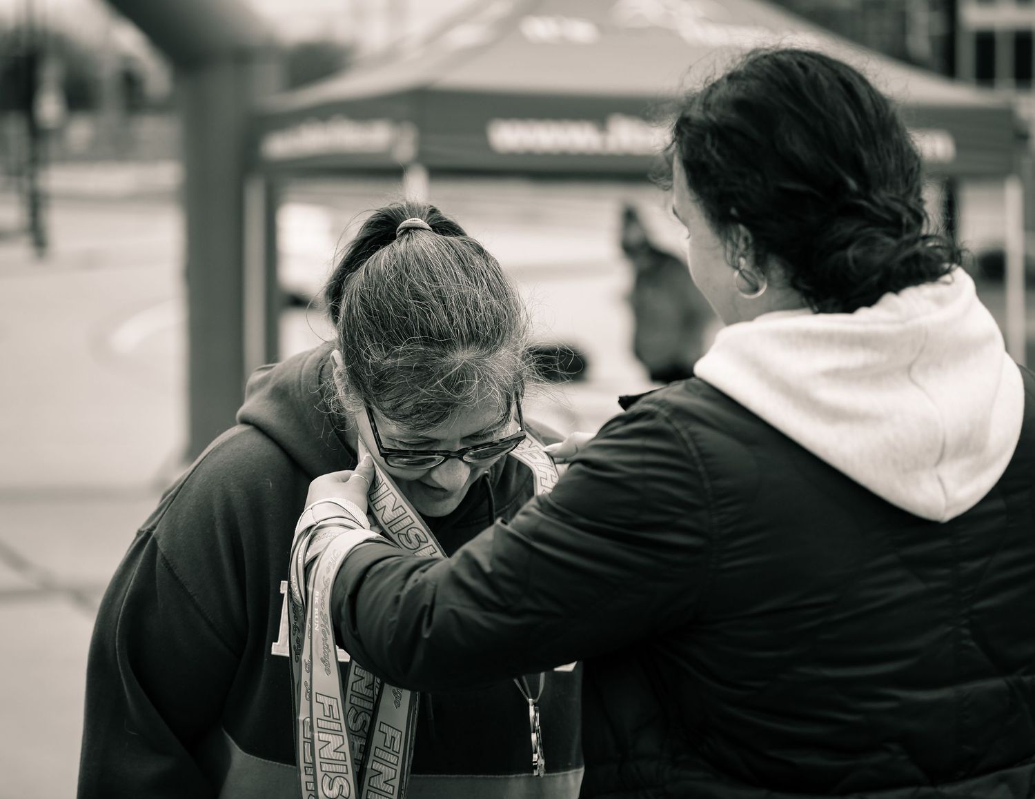 Black and white photo sequence showing a couple embracing in progressive stages of closeness and comfort.