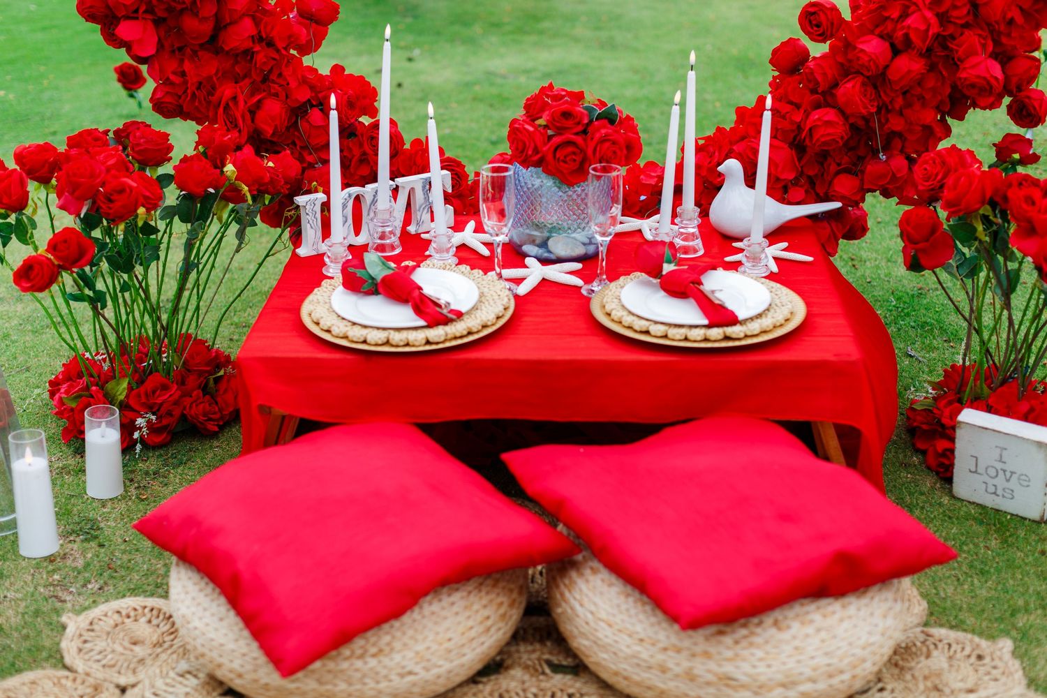 Picnic setup with red roses and red heart arch in San Juan, Puerto Rico.