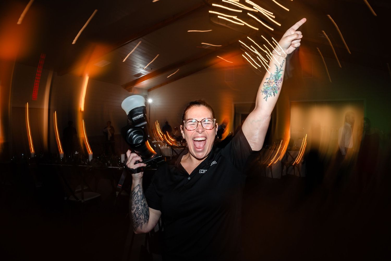 Dynamic nighttime dance floor photography with streaks of light and movement.
