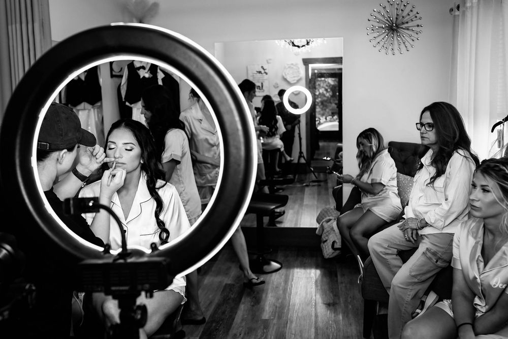 Black and white candid shots of wedding reception dancing and celebrations.